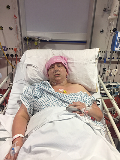 woman lying in hospital after surgery