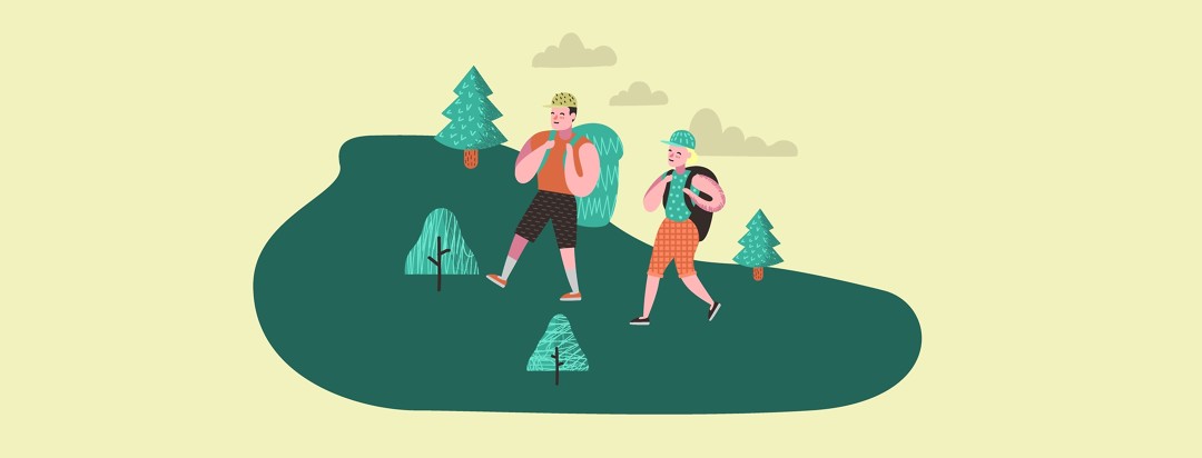 a man and woman wearing large backpacks walking through trees