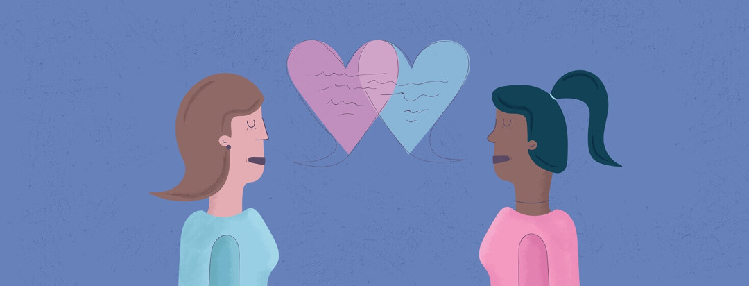 Two women talking and their speech bubbles form hearts