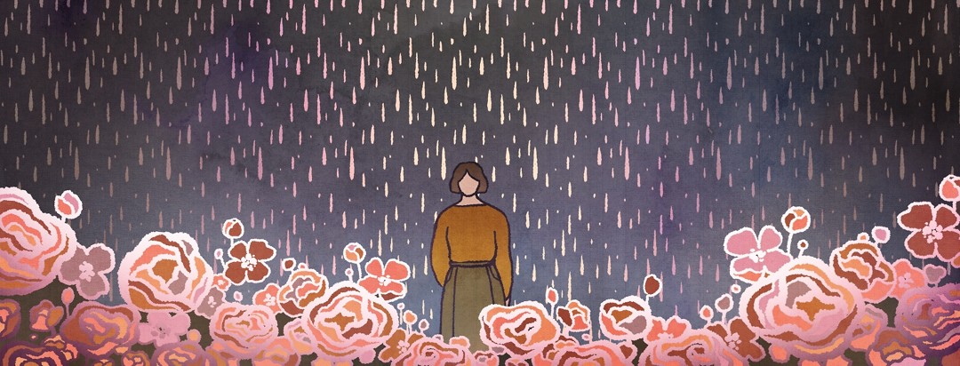 A woman stands under gloomy rain, surrounded by a field of flowers.