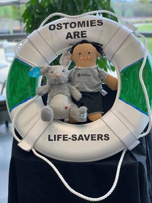 Image of a doll and stuffed bunny inside of life ring with text: Ostomies are life-savers